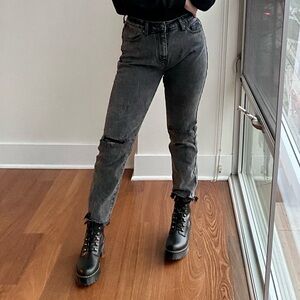 Faded black distressed ankle jeans